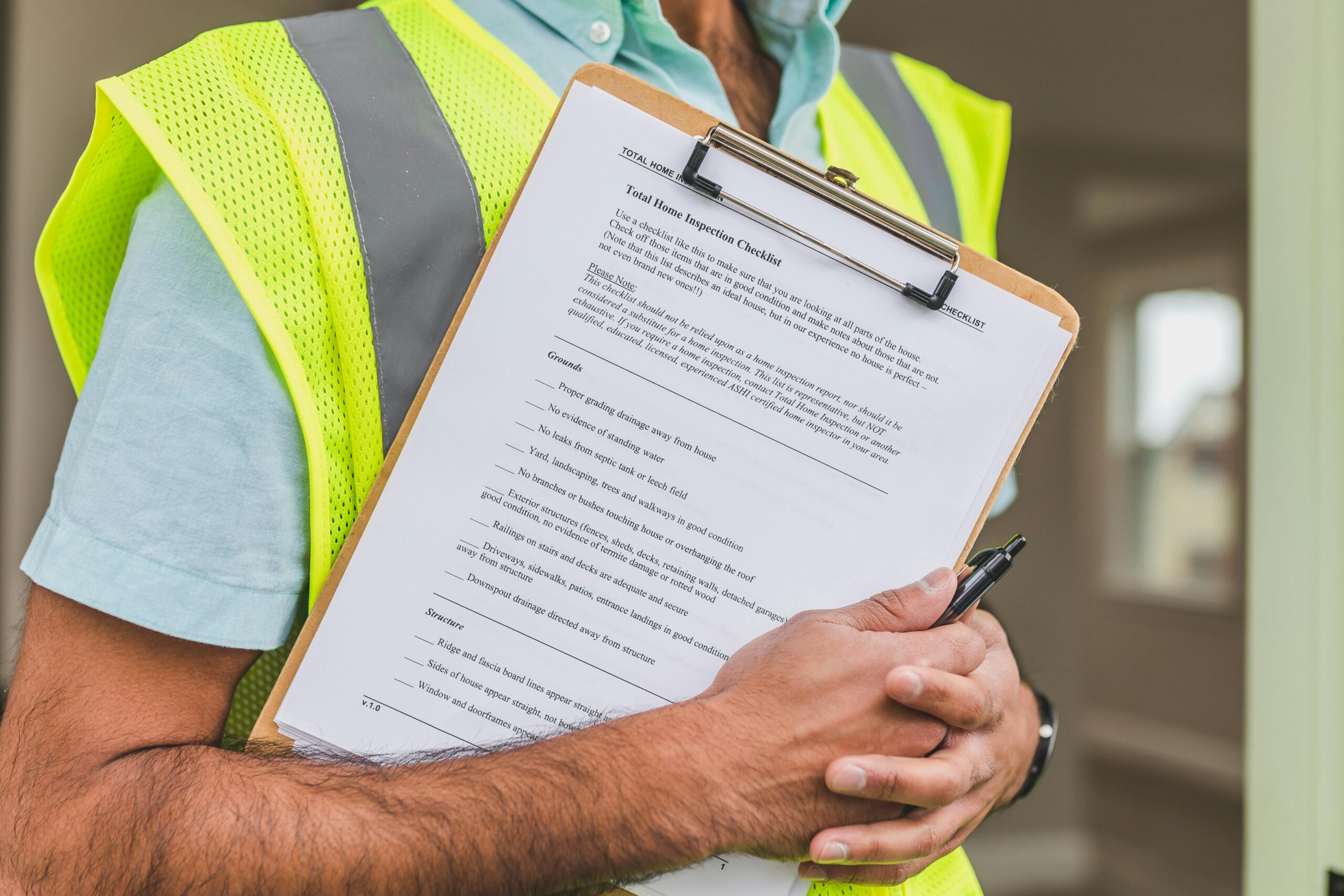 Insurance adjuster with clipboard documenting water damage claim in Gilbert AZ